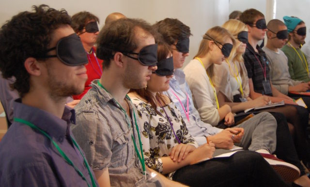 Blindfolded participants listening to original 'pdx' audio compositions at MEX/9 in 2011